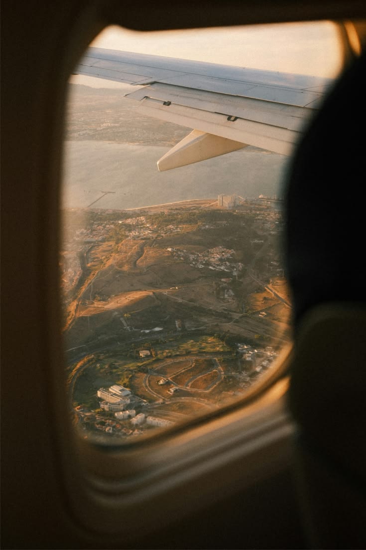 View from a plane window at golden hour