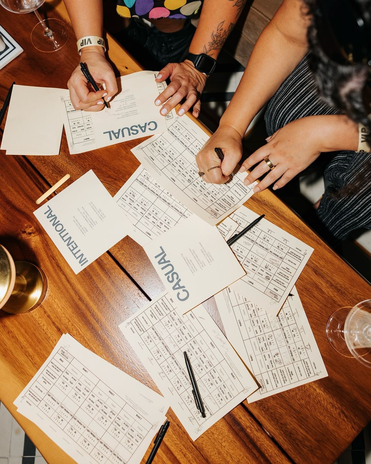 Women writing on worksheets together around a table